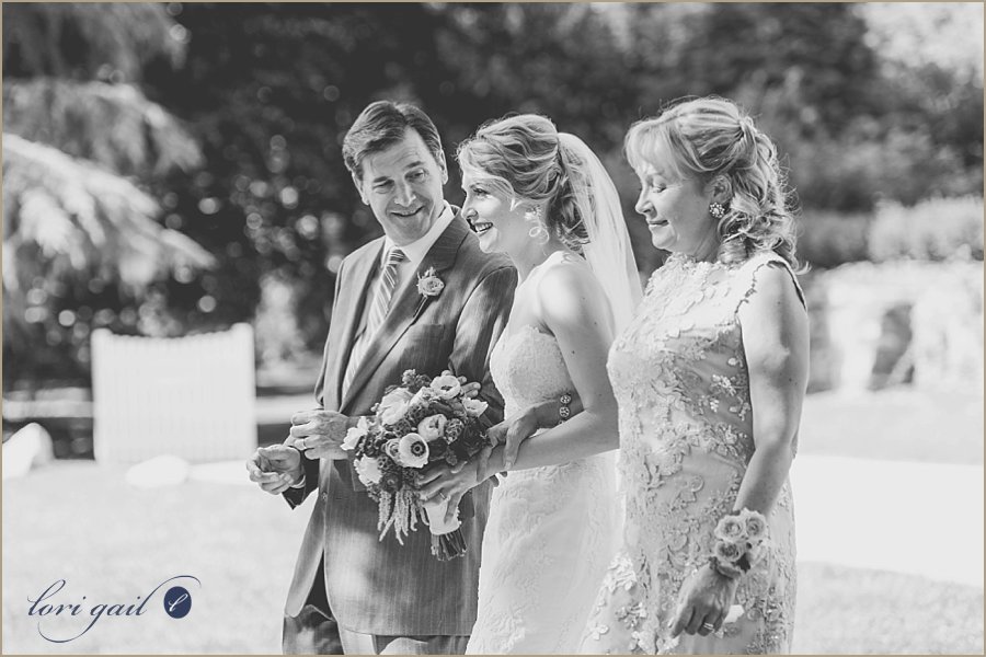 Mom and Dad walk Lisa down the aisle.